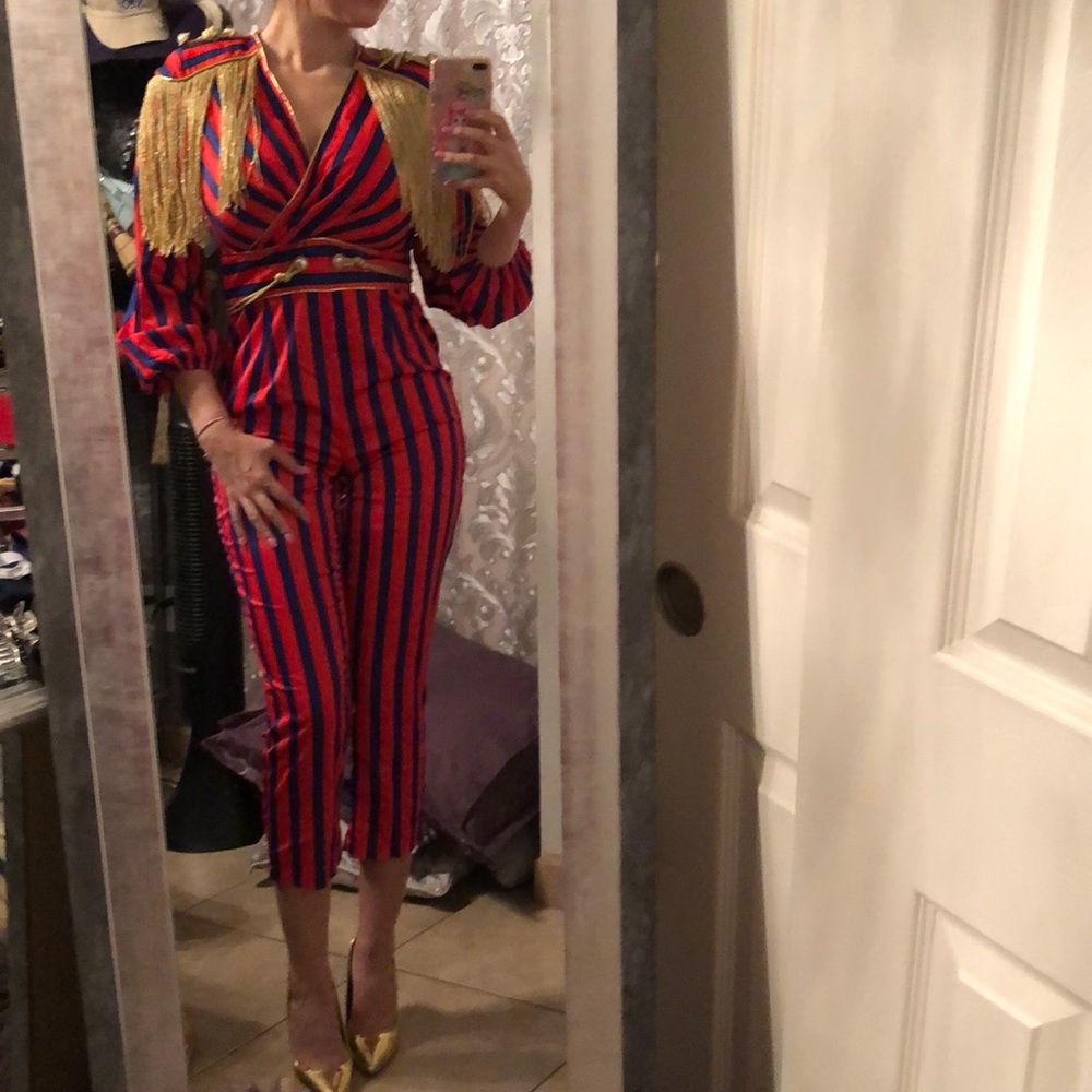 Brand new jumpsuit. Red and blue colors.